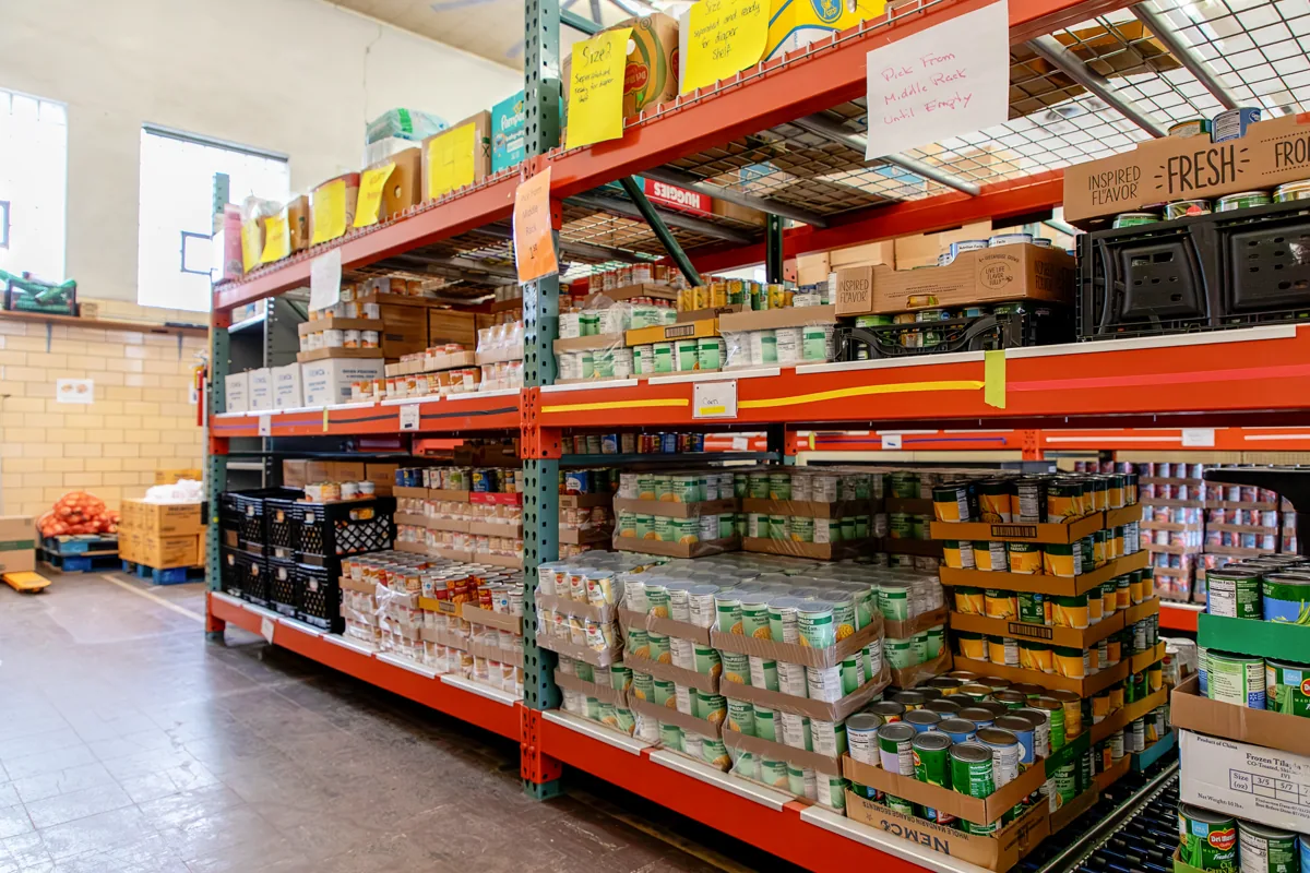 Loaded pallet racking storing food bank inventory
